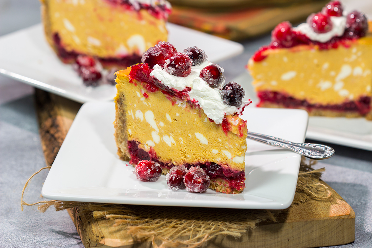 This Cranberry Pumpkin Cheesecake features a creamy pumpkin cheesecake over a layer of cranberry sauce. It's a delicious dessert that's perfect for fall!