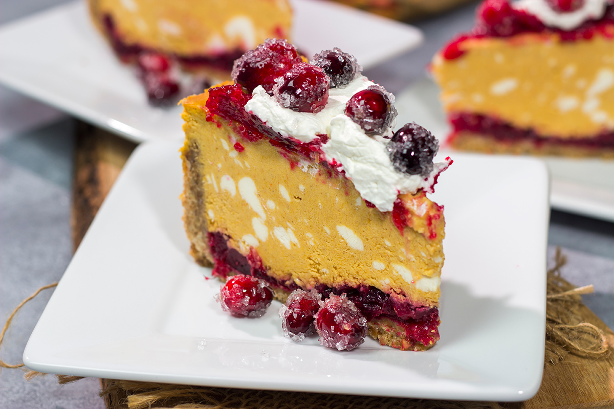 This Cranberry Pumpkin Cheesecake features a creamy pumpkin cheesecake over a layer of cranberry sauce. It's a delicious dessert that's perfect for fall!