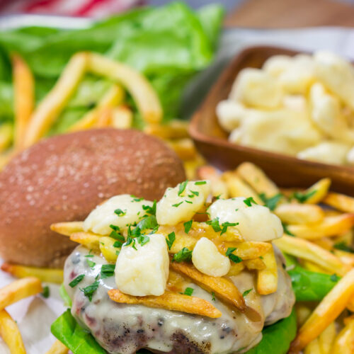 Topped with French fries, cheese curds and gravy, this Grilled Poutine Burger is a fun way to mix up summer grilling!
