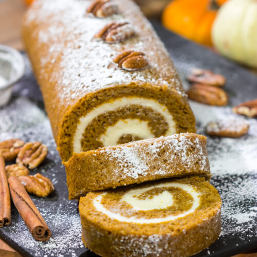 This Pumpkin Roll Cake features a spiced pumpkin bread filled with a delicious cream cheese frosting. It's a great dessert for celebrating chilly fall days!