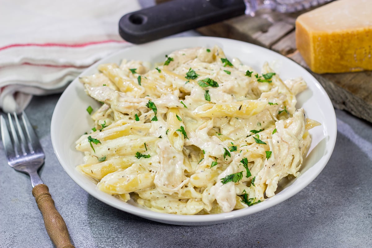 This Slow Cooker Chicken Alfredo recipe only requires about 10 minutes of prep time. It's the perfect comfort food to warm you up on a cold day!