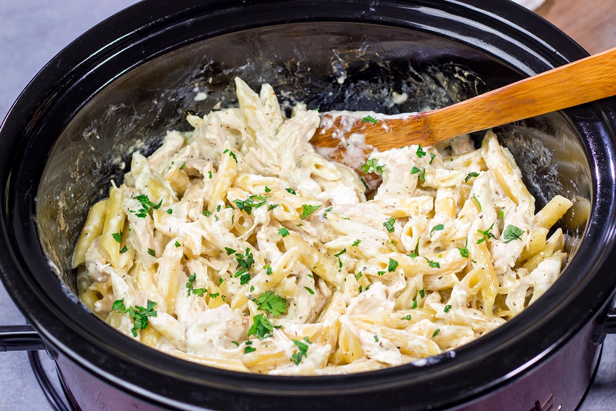 This Slow Cooker Chicken Alfredo recipe only requires about 10 minutes of prep time. It's the perfect comfort food to warm you up on a cold day!