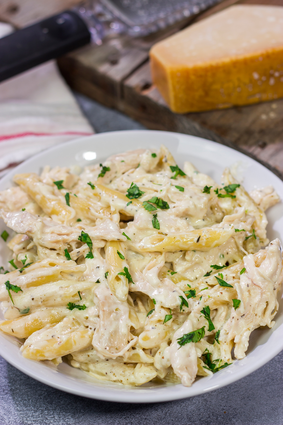 This Slow Cooker Chicken Alfredo recipe only requires about 10 minutes of prep time. It's the perfect comfort food to warm you up on a cold day!