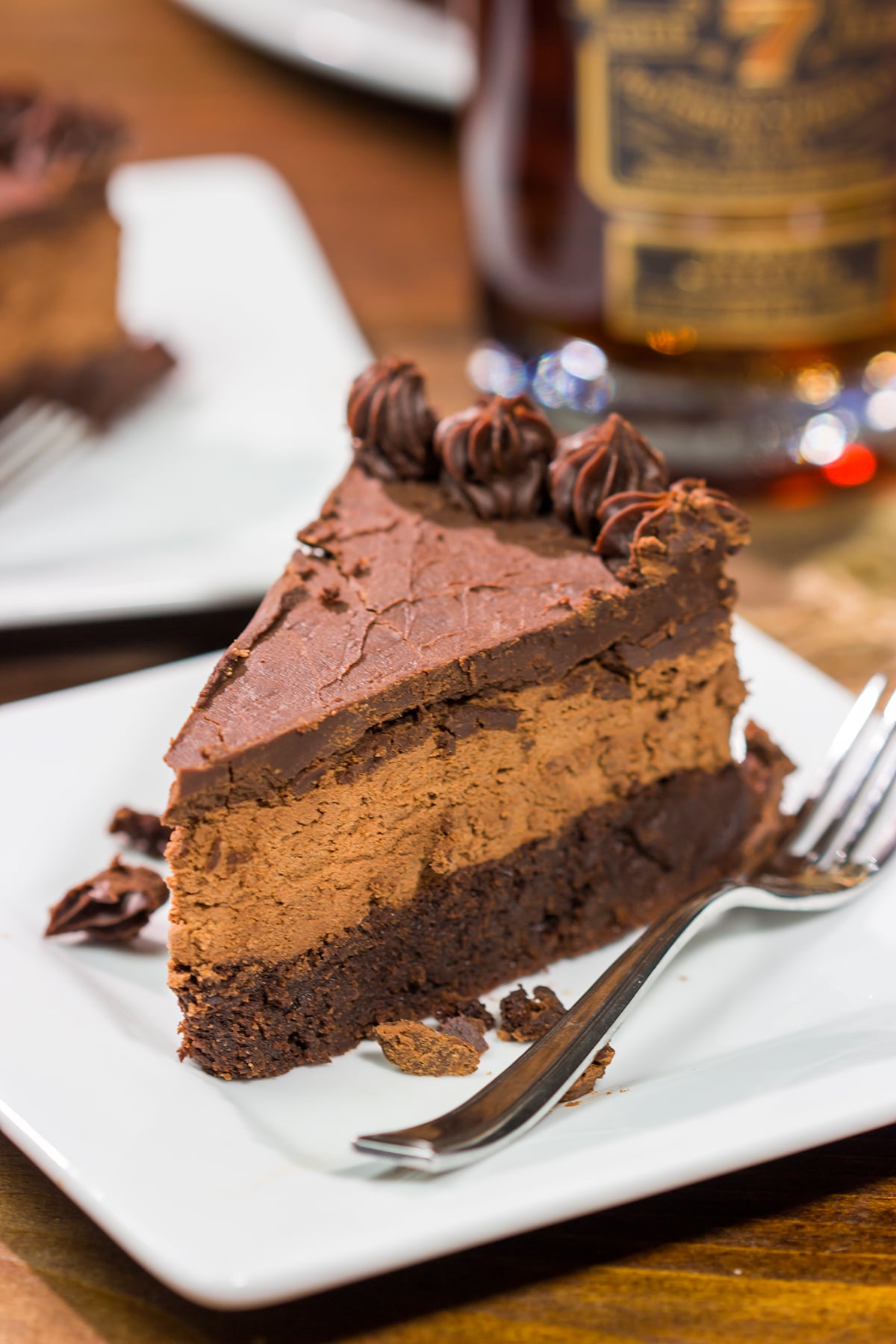 This 3-layer Bourbon Chocolate Mousse Cake is sure to satisfy any chocoholic in your life! Grab a slice for dessert tonight!