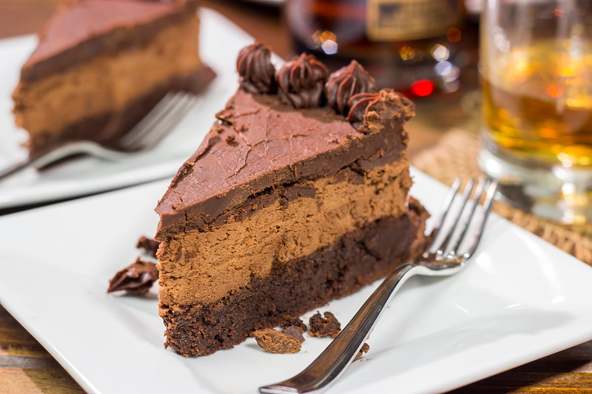 This 3-layer Bourbon Chocolate Mousse Cake is sure to satisfy any chocoholic in your life! Grab a slice for dessert tonight!