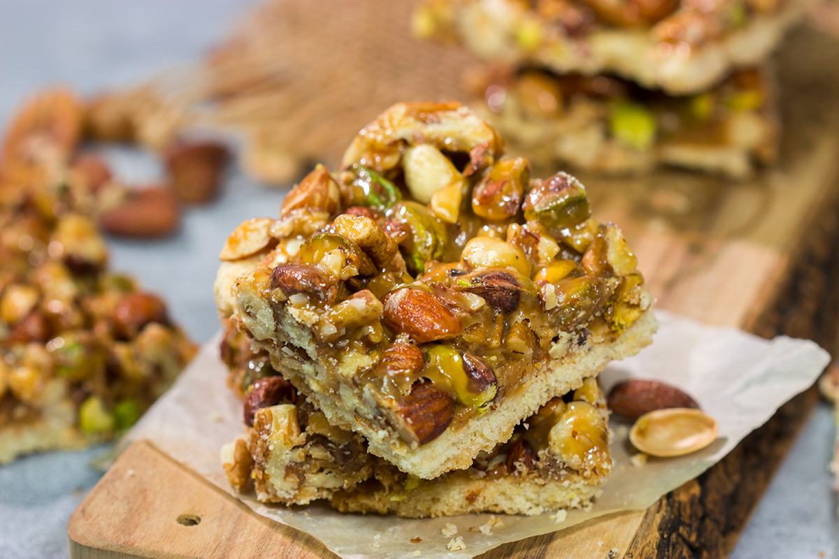 These Caramel Nut Bars feature a mixture of mixed nuts and caramel on top of a buttery shortbread crust. Good luck eating just one!