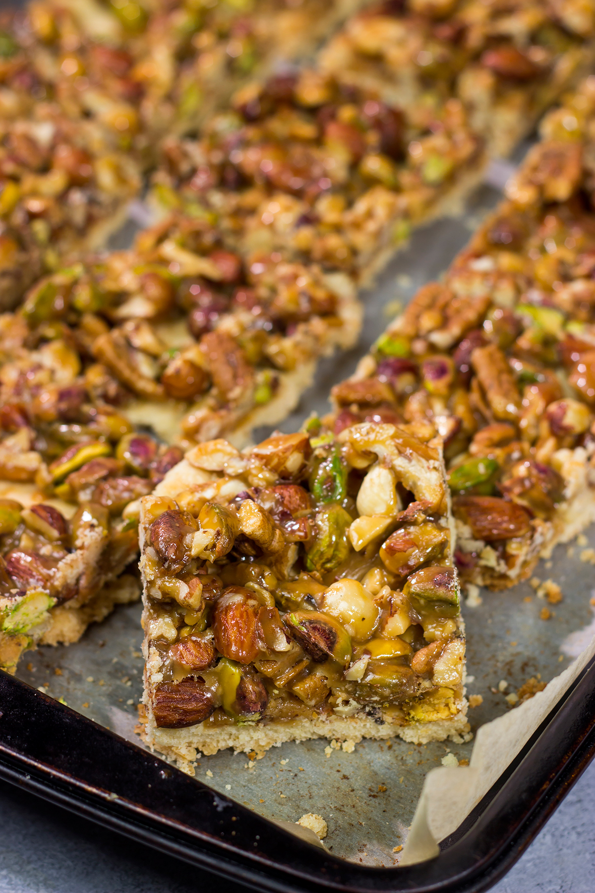 These Caramel Nut Bars feature a mixture of mixed nuts and caramel on top of a buttery shortbread crust. Good luck eating just one!