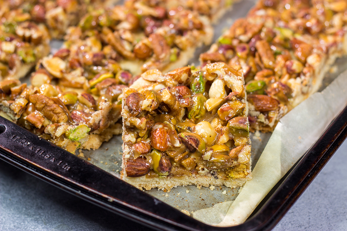 These Caramel Nut Bars feature a mixture of mixed nuts and caramel on top of a buttery shortbread crust. Good luck eating just one!