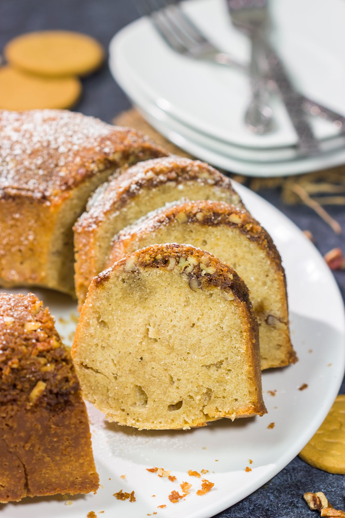 Grab a box of gingersnap cookies! Topped with a crunchy gingersnap pecan topping, this Gingersnap Pound Cake is a tasty dessert for the holidays!