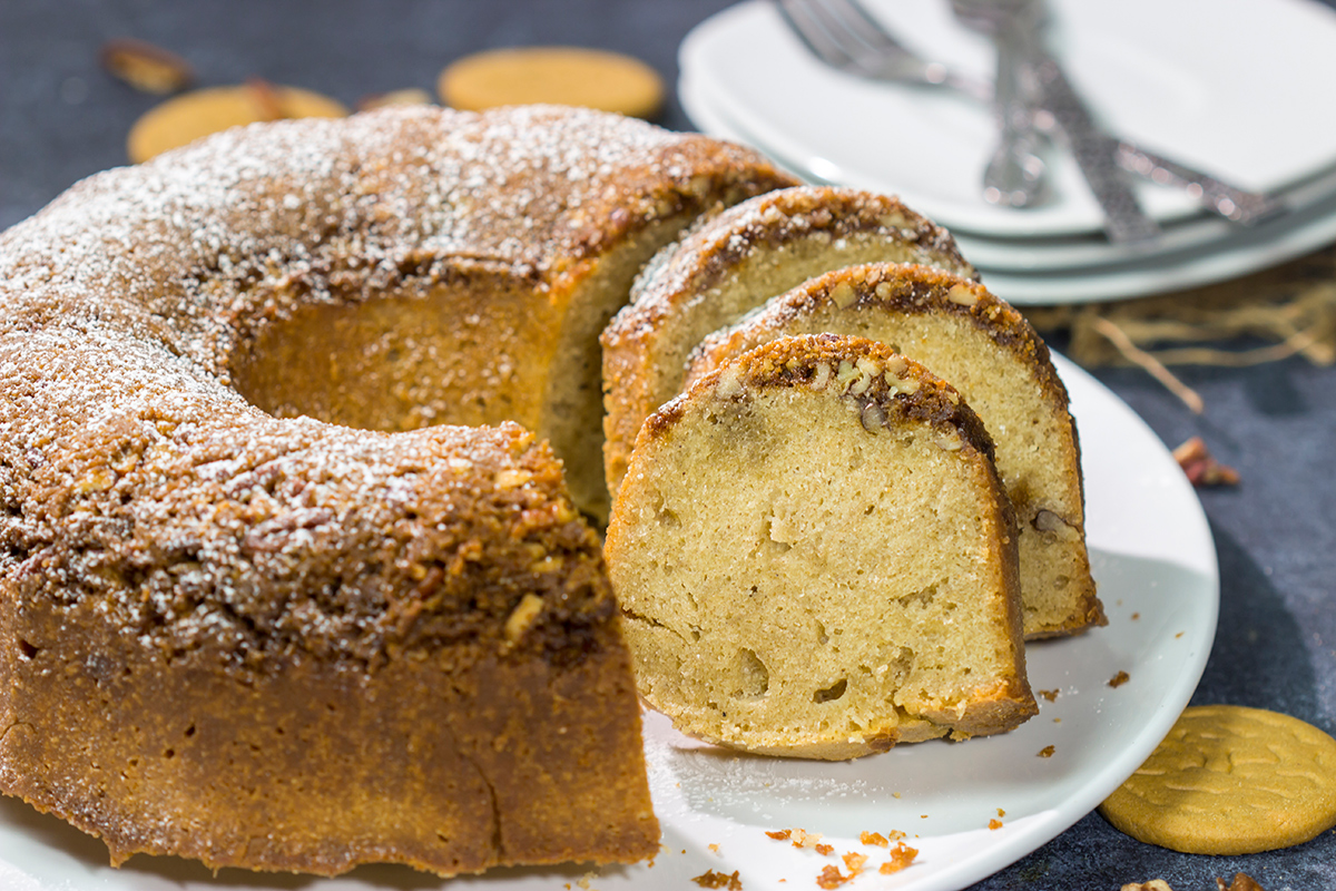 Grab a box of gingersnap cookies! Topped with a crunchy gingersnap pecan topping, this Gingersnap Pound Cake is a tasty dessert for the holidays!