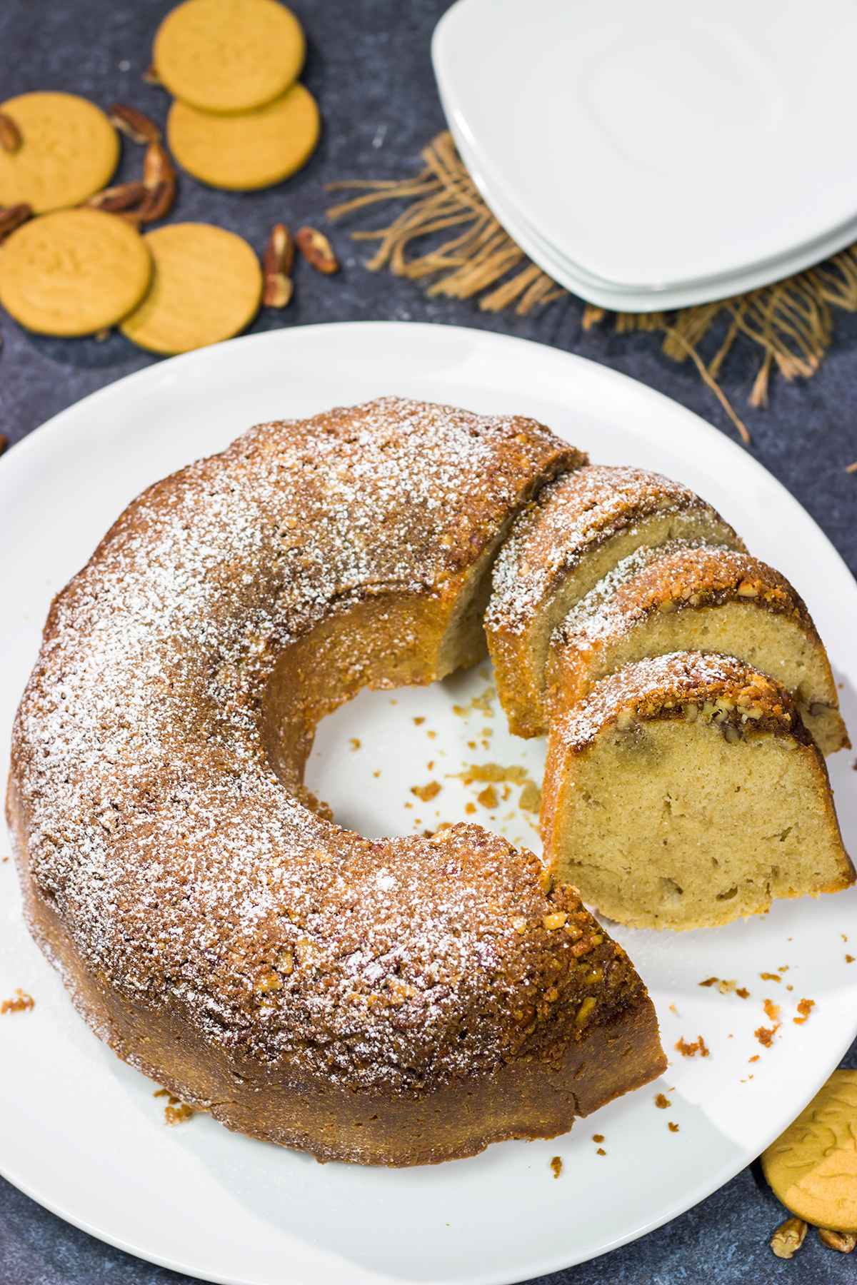 Grab a box of gingersnap cookies! Topped with a crunchy gingersnap pecan topping, this Gingersnap Pound Cake is a tasty dessert for the holidays!