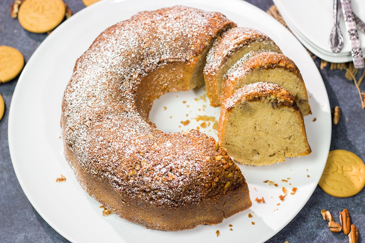 Grab a box of gingersnap cookies! Topped with a crunchy gingersnap pecan topping, this Gingersnap Pound Cake is a tasty dessert for the holidays!