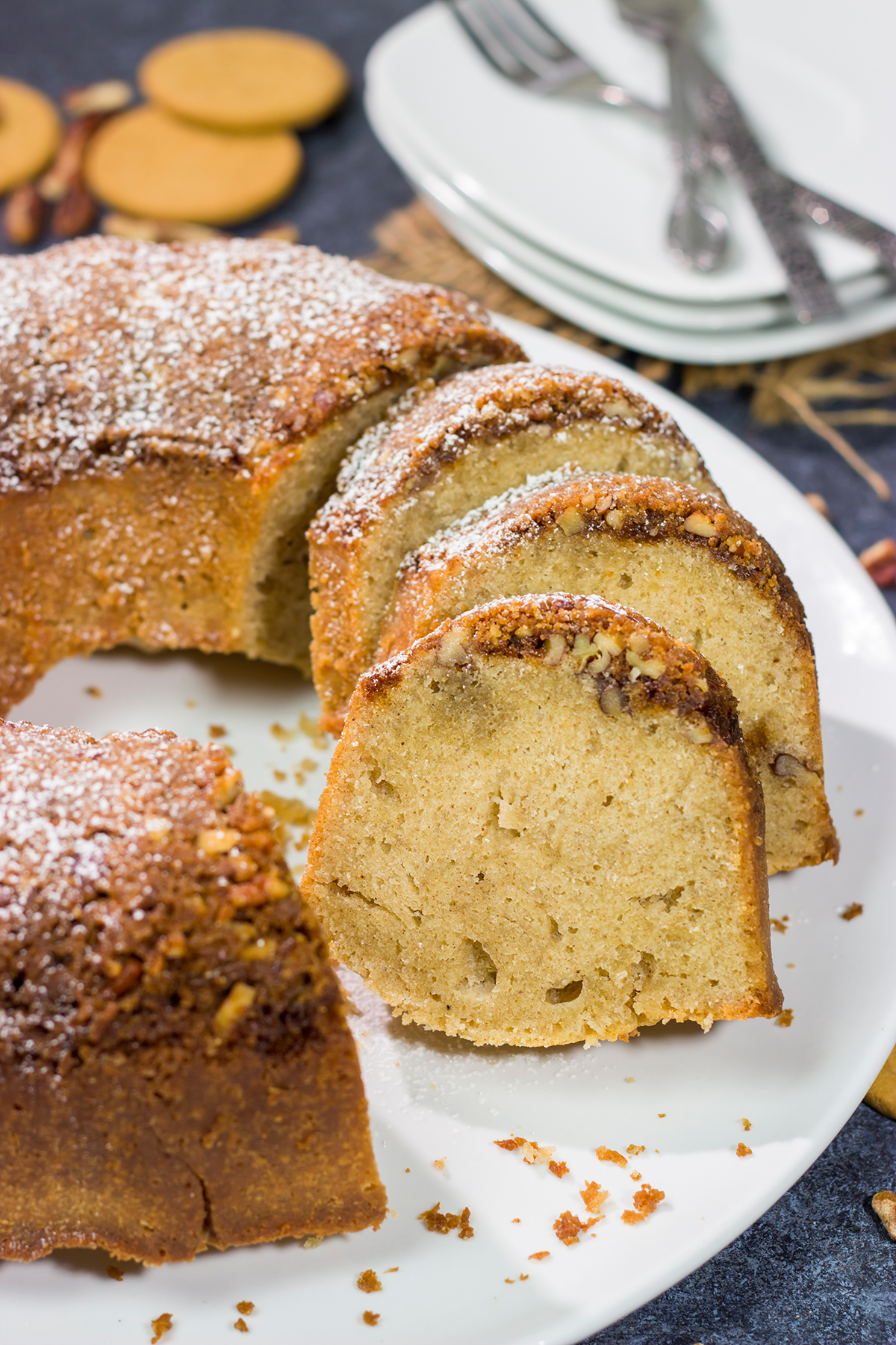 Grab a box of gingersnap cookies! Topped with a crunchy gingersnap pecan topping, this Gingersnap Pound Cake is a tasty dessert for the holidays!