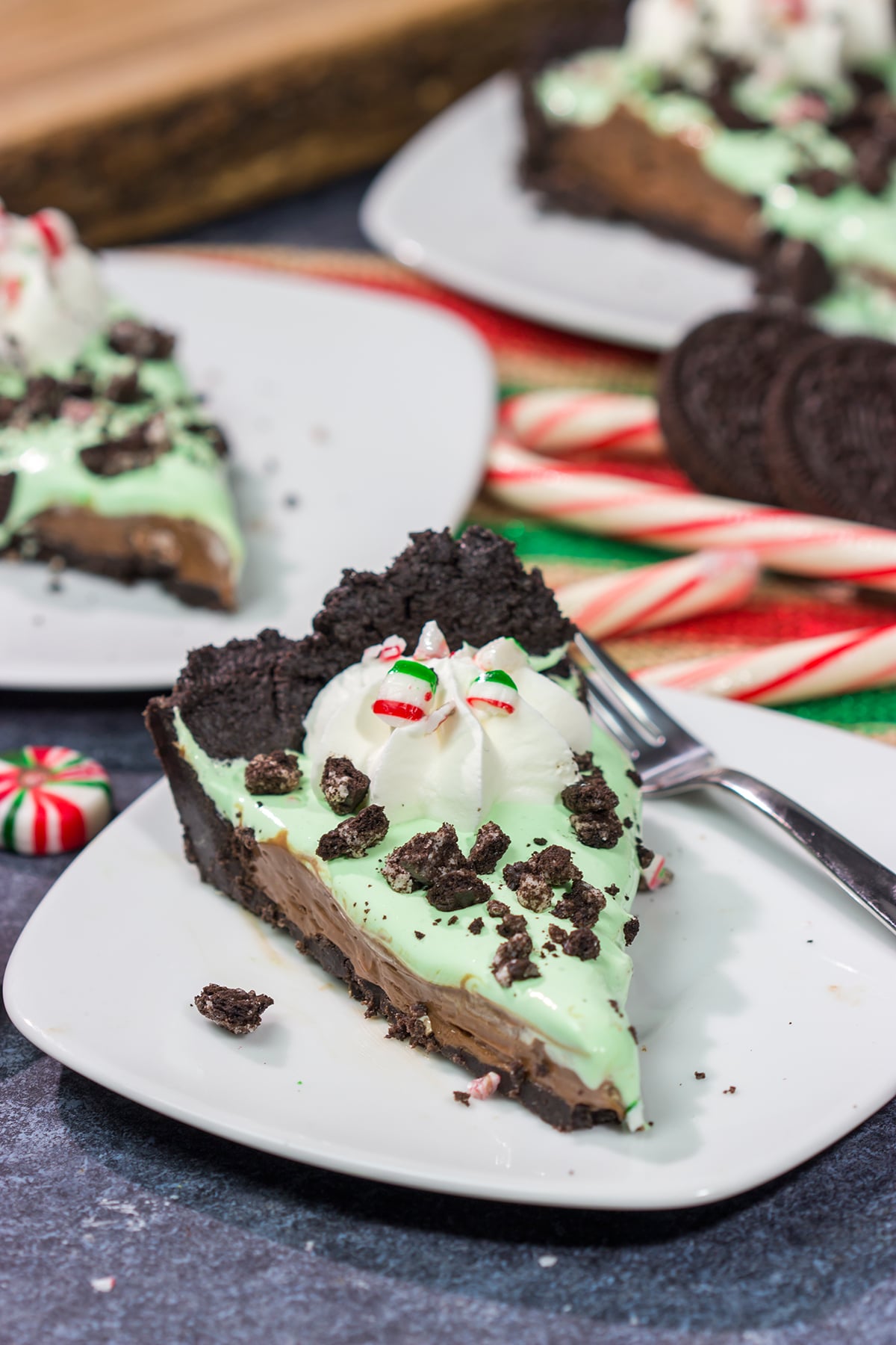 Topped with crushed candy canes and Oreos, this No Bake Mint Chocolate Pie is a fun and easy dessert for the holiday season!