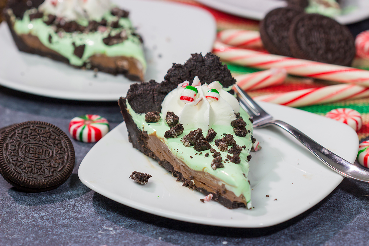 Topped with crushed candy canes and Oreos, this No Bake Mint Chocolate Pie is a fun and easy dessert for the holiday season!