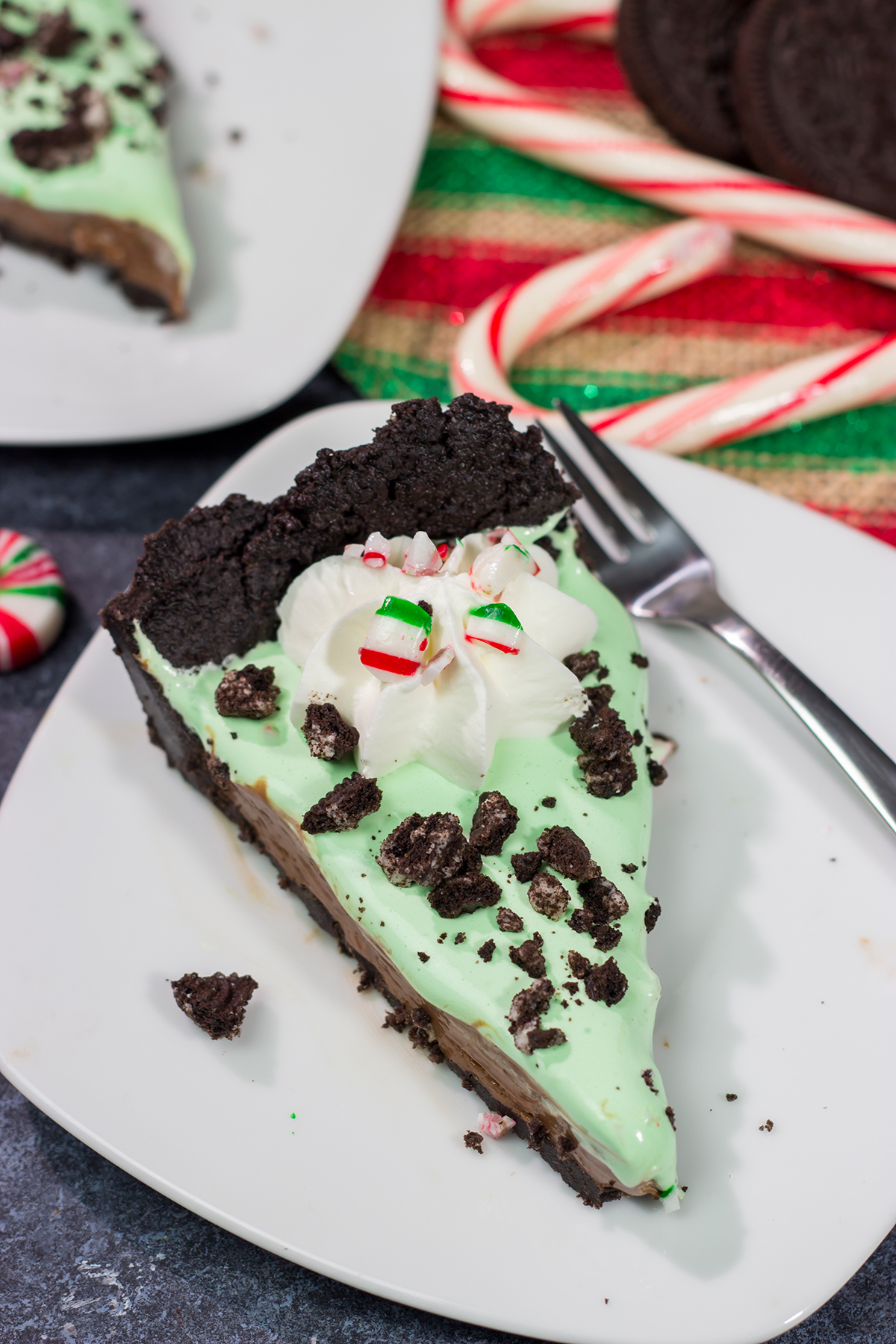 Topped with crushed candy canes and Oreos, this No Bake Mint Chocolate Pie is a fun and easy dessert for the holiday season!
