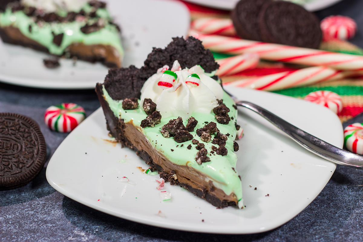 Topped with crushed candy canes and Oreos, this No Bake Mint Chocolate Pie is a fun and easy dessert for the holiday season!