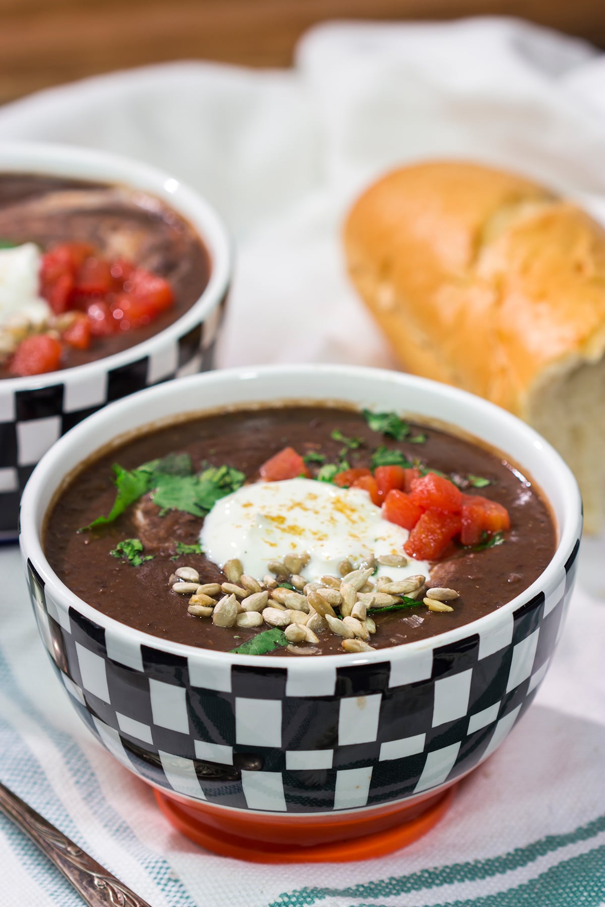 This Slow Cooker Black Bean Soup features the flavors of seasoned black beans...in a creamy soup form. It's delicious on a chilly winter day!