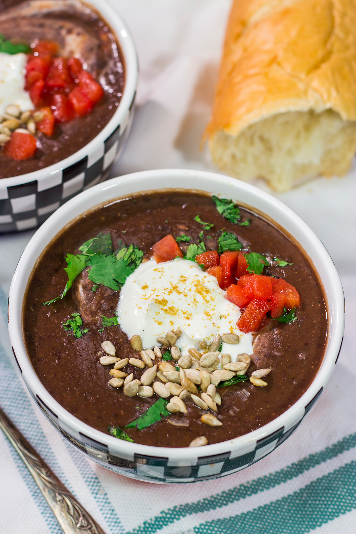 This Slow Cooker Black Bean Soup features the flavors of seasoned black beans...in a creamy soup form. It's delicious on a chilly winter day!