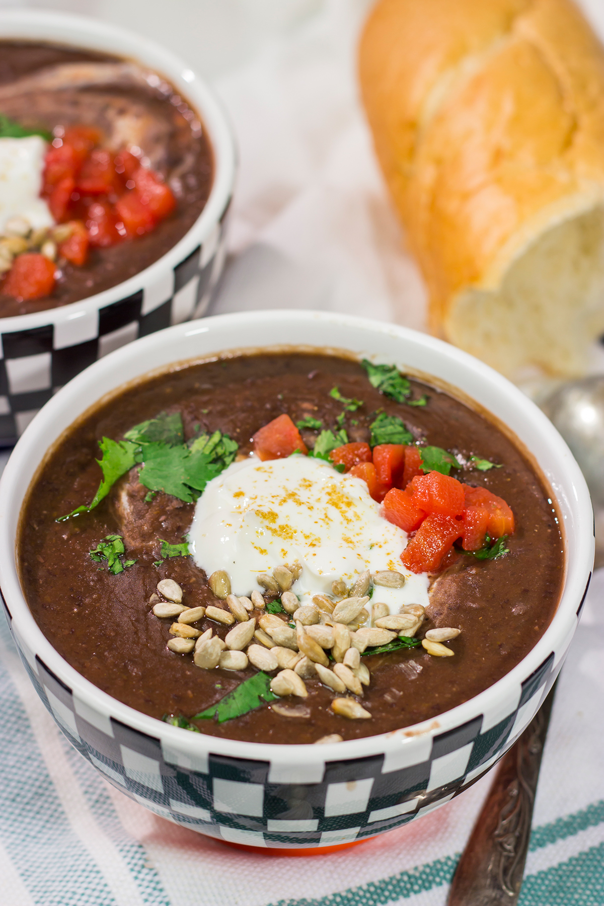 This Slow Cooker Black Bean Soup features the flavors of seasoned black beans...in a creamy soup form. It's delicious on a chilly winter day!