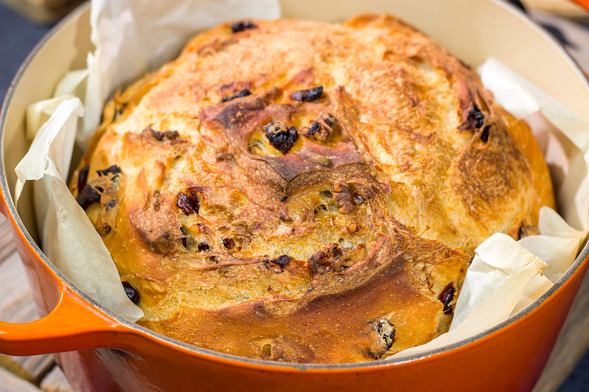 This no-knead Cranberry Walnut Bread is studded with dried cranberry and chopped walnuts. The result is a delicious loaf of rustic homemade bread!