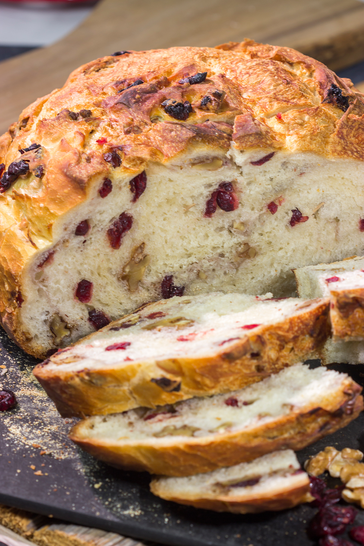This no-knead Cranberry Walnut Bread is studded with dried cranberry and chopped walnuts. The result is a delicious loaf of rustic homemade bread!