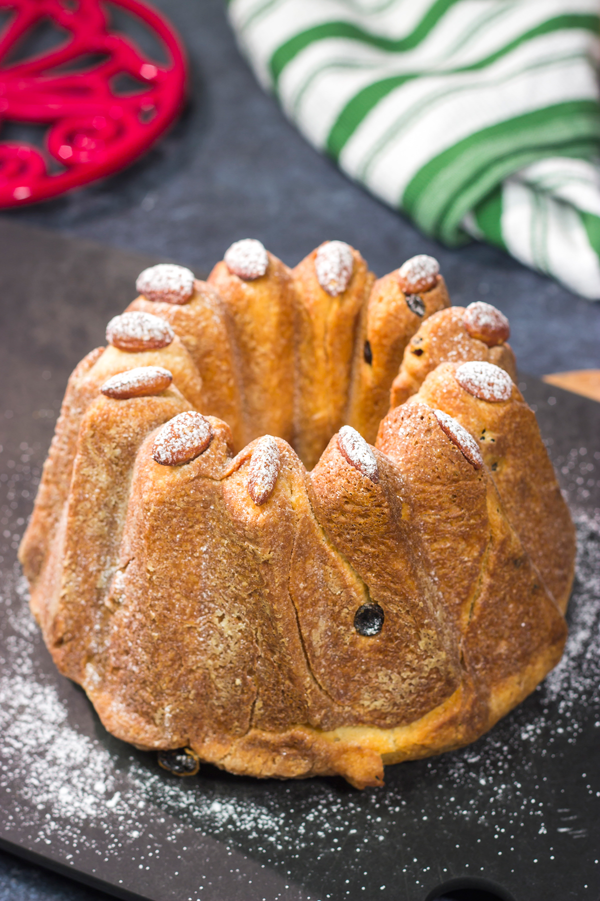 Featuring rum or kirsch-soaked raisins, whole almonds and a dusting of confectioner's sugar, this traditional Kugelhopf recipe makes for a fantastic holiday treat!