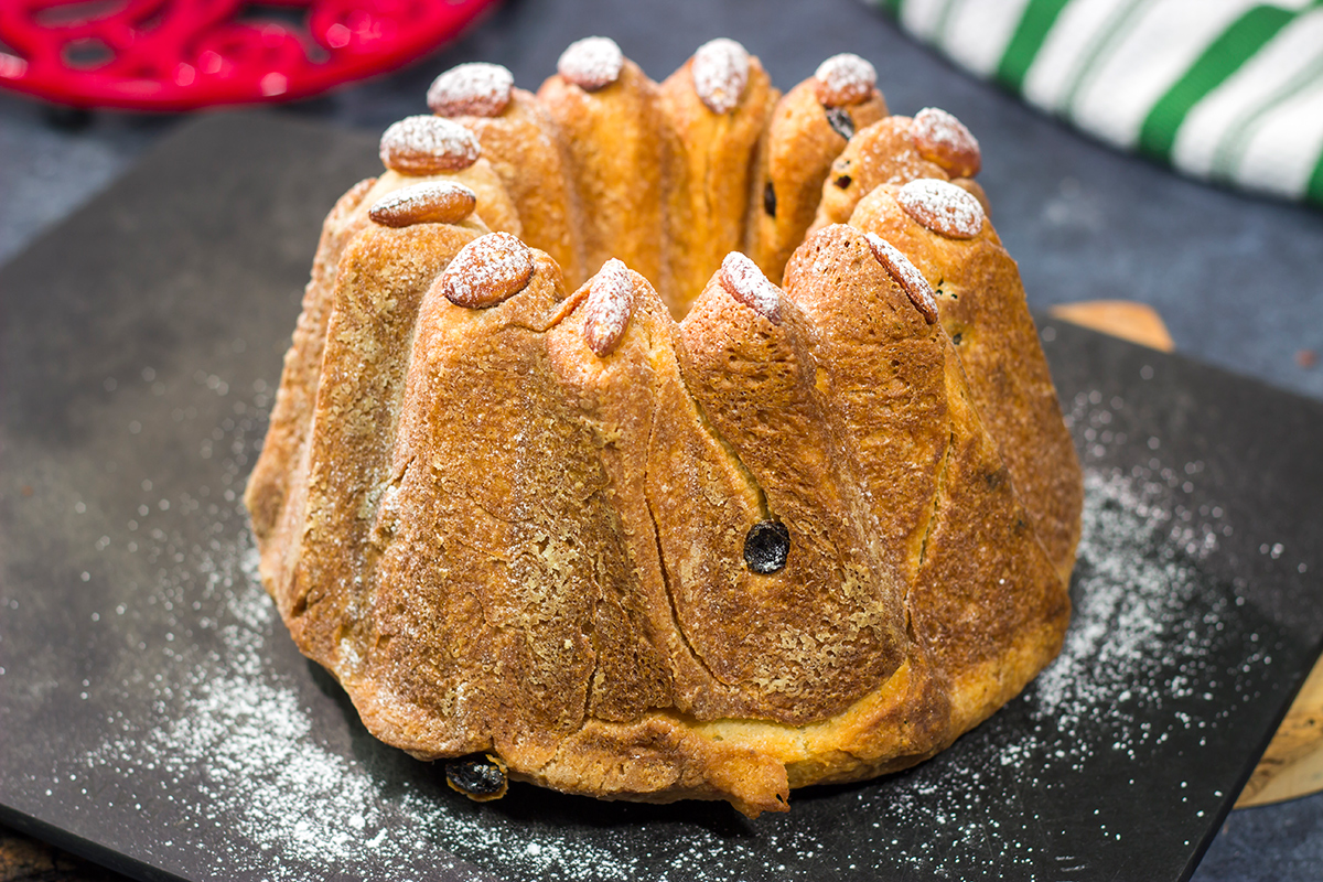 Featuring rum or kirsch-soaked raisins, whole almonds and a dusting of confectioner's sugar, this traditional Kugelhopf recipe makes for a fantastic holiday treat!