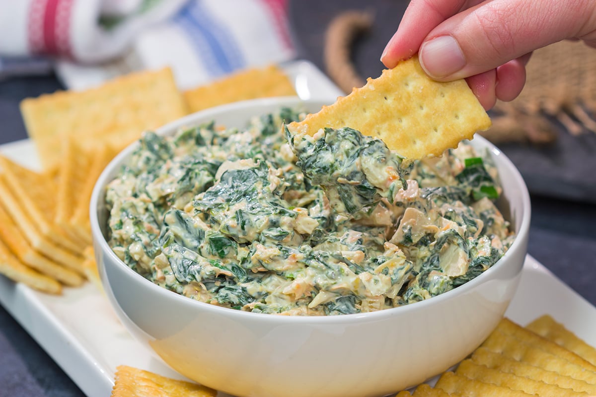 Made with fresh baby spinach, this Fresh Spinach Dip is an easy and delicious appetizer recipe. Grab some fresh veggies or crackers and dig in!