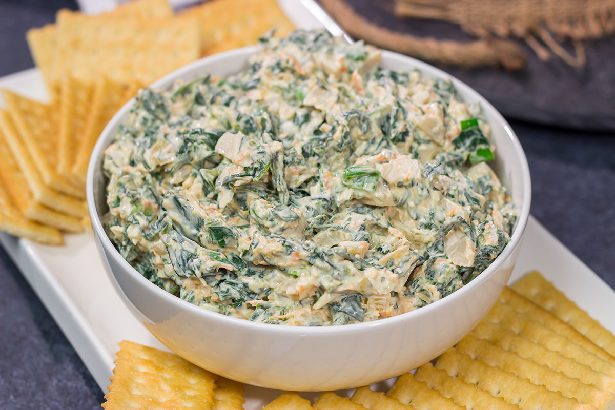 Made with fresh baby spinach, this Fresh Spinach Dip is an easy and delicious appetizer recipe. Grab some fresh veggies or crackers and dig in!