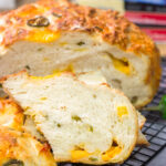 This Jalapeno Cheddar Bread features chunks of cheddar cheese and diced jalapenos mixed into a classic rustic bread. This bread makes fantastic grilled cheese sandwiches!!