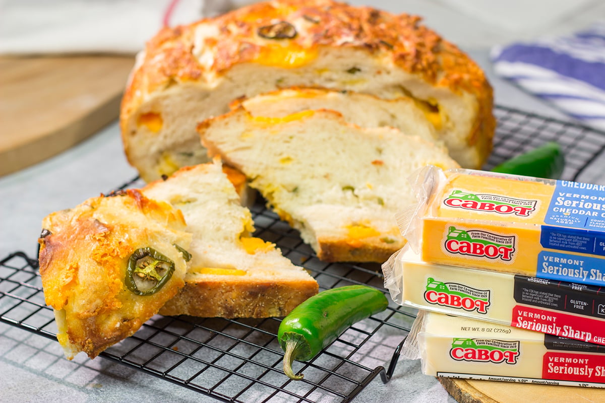 This Jalapeno Cheddar Bread features chunks of cheddar cheese and diced jalapenos mixed into a classic rustic bread. This bread makes fantastic grilled cheese sandwiches!!