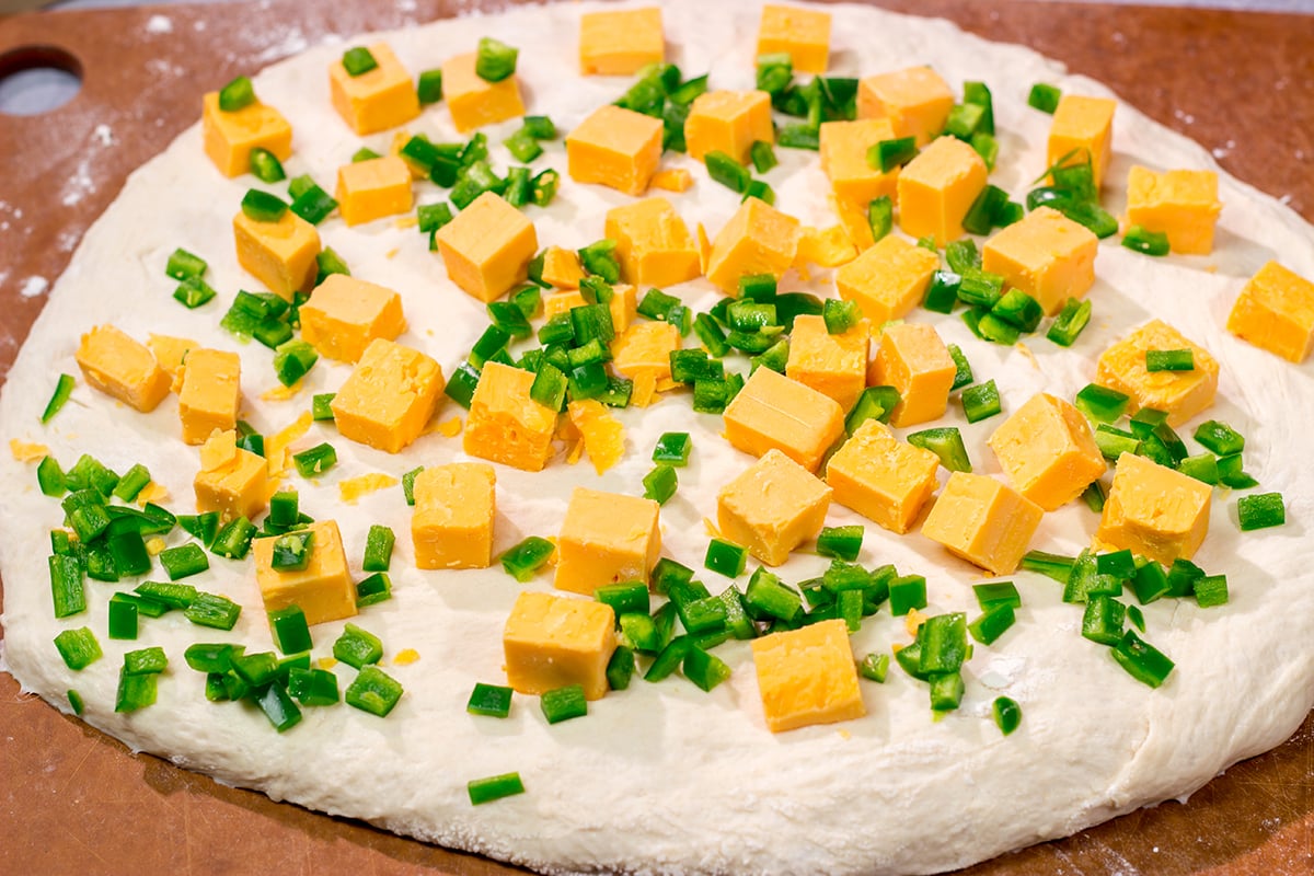 This Jalapeno Cheddar Bread features chunks of cheddar cheese and diced jalapenos mixed into a classic rustic bread. This bread makes fantastic grilled cheese sandwiches!!
