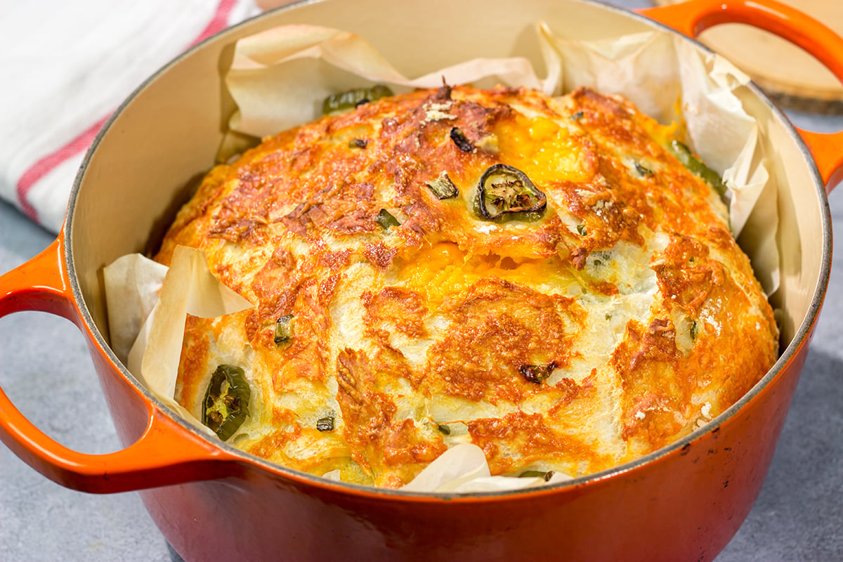This Jalapeno Cheddar Bread features chunks of cheddar cheese and diced jalapenos mixed into a classic rustic bread. This bread makes fantastic grilled cheese sandwiches!!