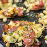 These Ranch Smashed Potatoes feature lots of crispy edges brushed with seasoned butter. These potatoes are perfect for when you need a new side dish recipe!