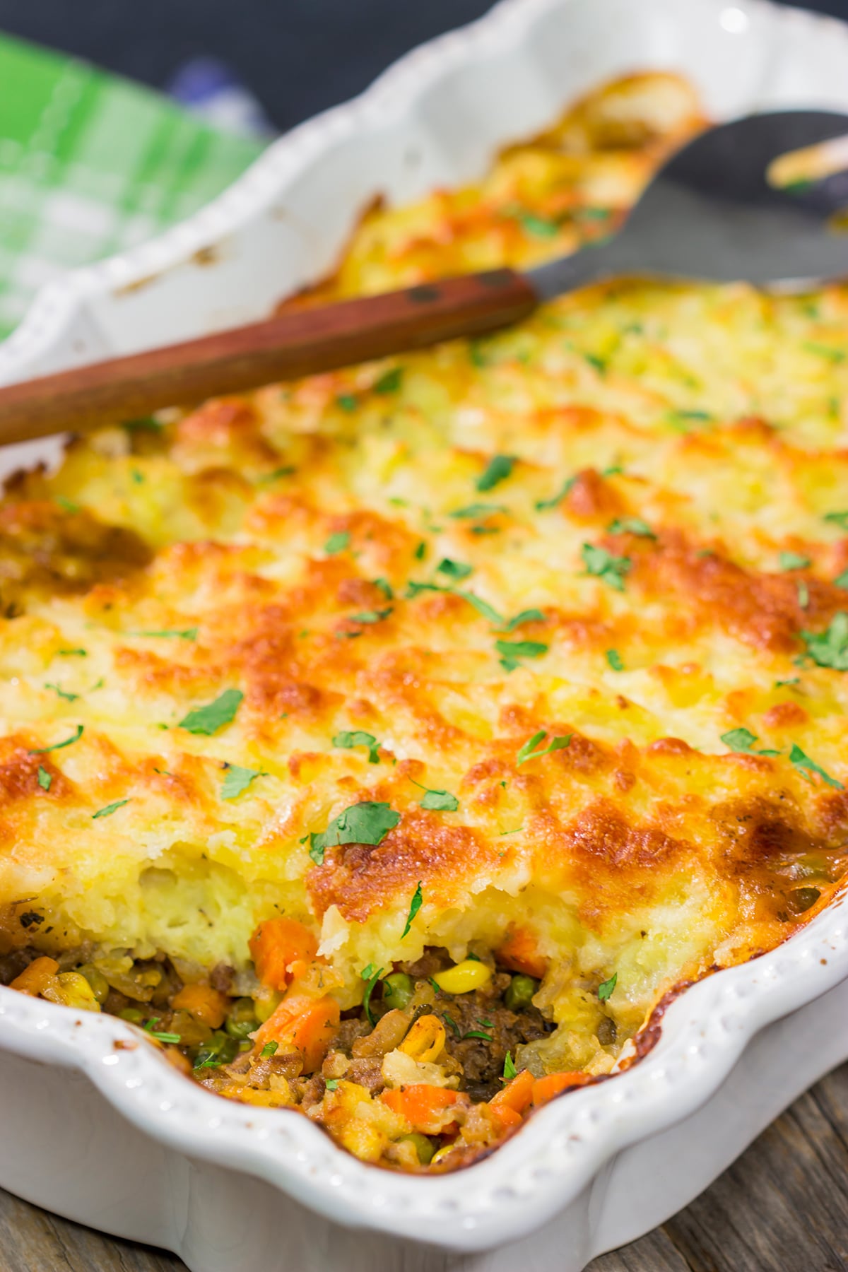 Featuring a ground beef or lamb and vegetable filling topped with cheesy mashed potatoes, this Shepherd's Pie is a classic comfort food meal!