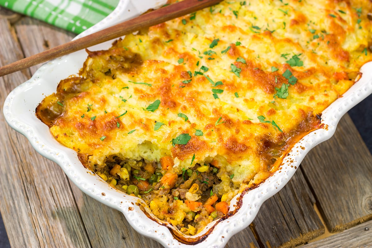Featuring a ground beef or lamb and vegetable filling topped with cheesy mashed potatoes, this Shepherd's Pie is a classic comfort food meal!