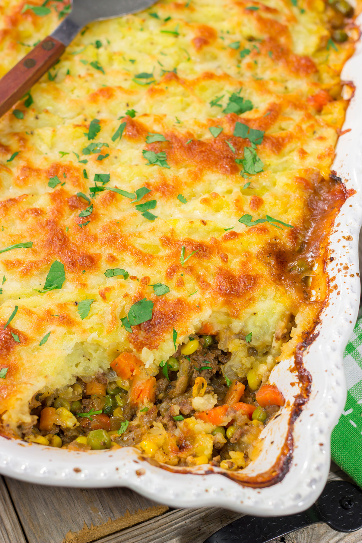 Featuring a ground beef or lamb and vegetable filling topped with cheesy mashed potatoes, this Shepherd's Pie is a classic comfort food meal!