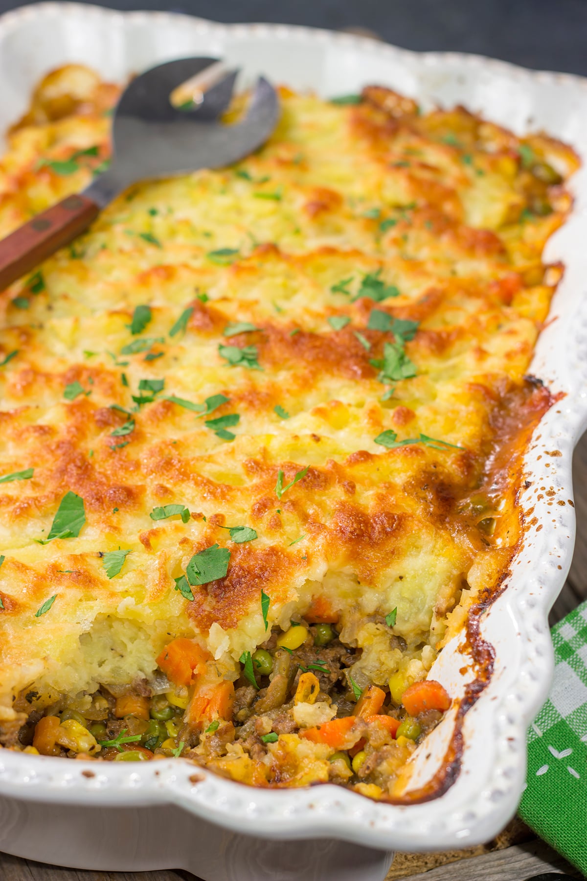 Featuring a ground beef or lamb and vegetable filling topped with cheesy mashed potatoes, this Shepherd's Pie is a classic comfort food meal!