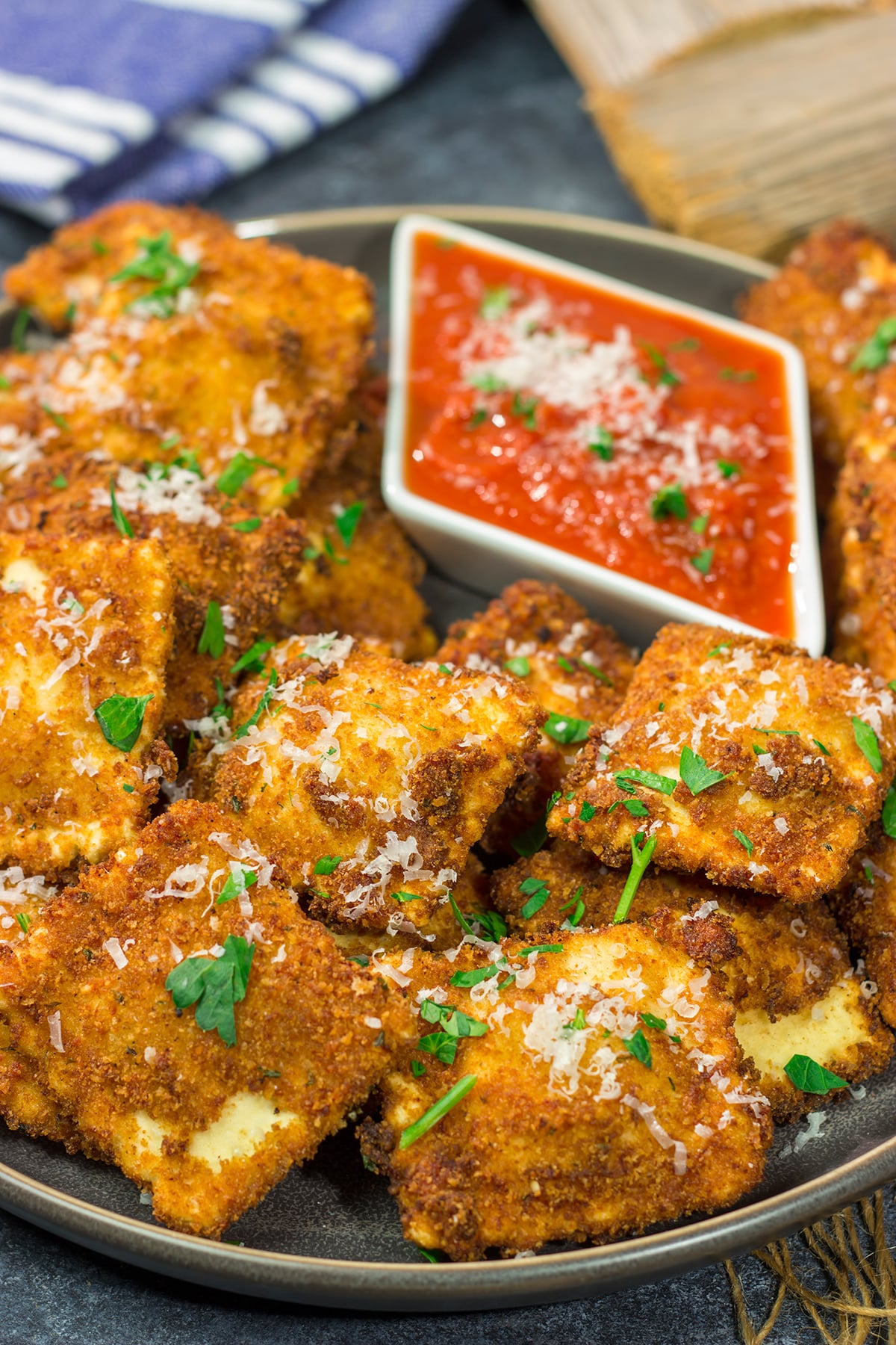 Originating in St. Louis, Toasted Ravioli are fried ravioli served with warm marinara sauce for dipping. These are a fantastic gameday appetizer!