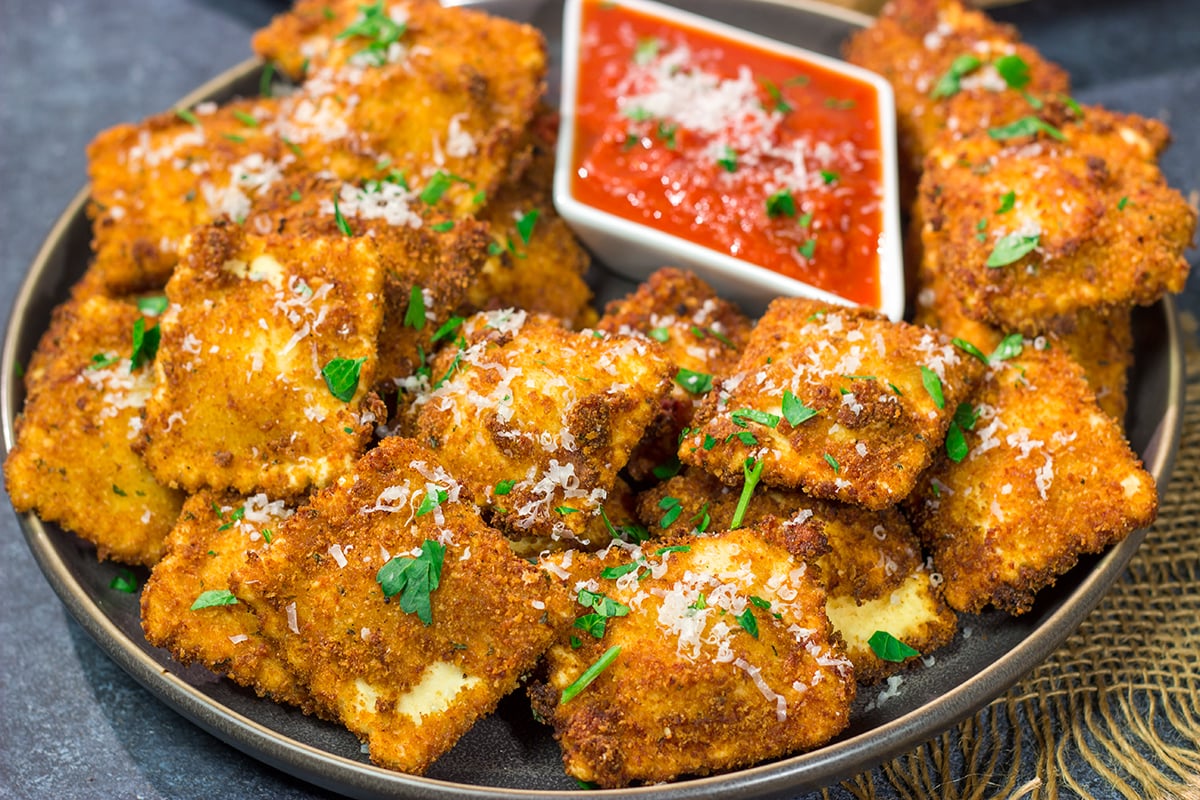 Originating in St. Louis, Toasted Ravioli are fried ravioli served with warm marinara sauce for dipping. These are a fantastic gameday appetizer!