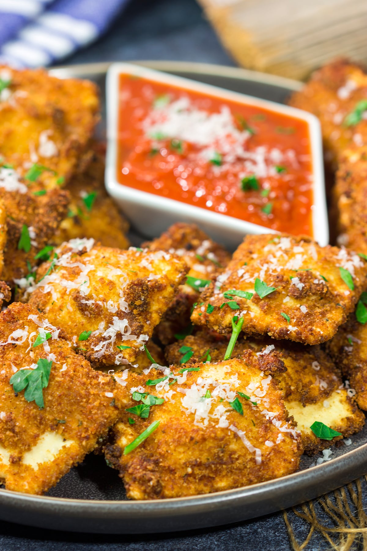 Originating in St. Louis, Toasted Ravioli are fried ravioli served with warm marinara sauce for dipping. These are a fantastic gameday appetizer!