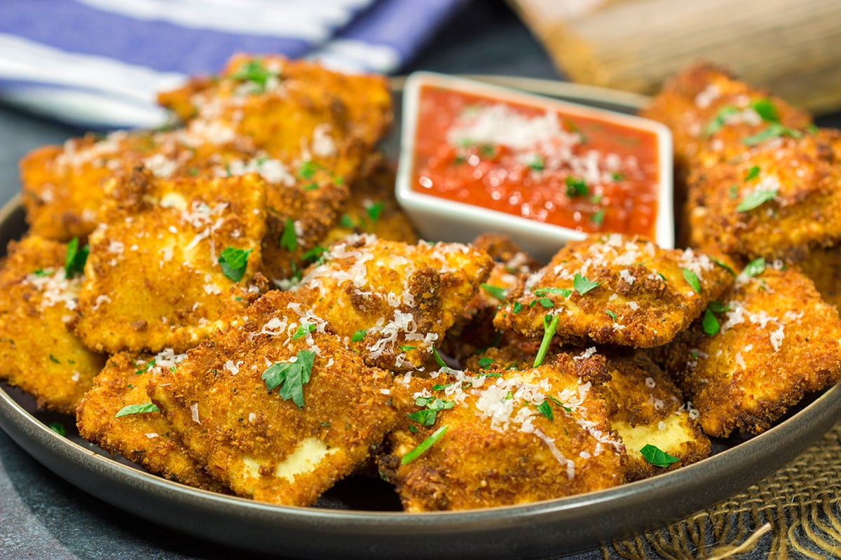 Originating in St. Louis, Toasted Ravioli are fried ravioli served with warm marinara sauce for dipping. These are a fantastic gameday appetizer!