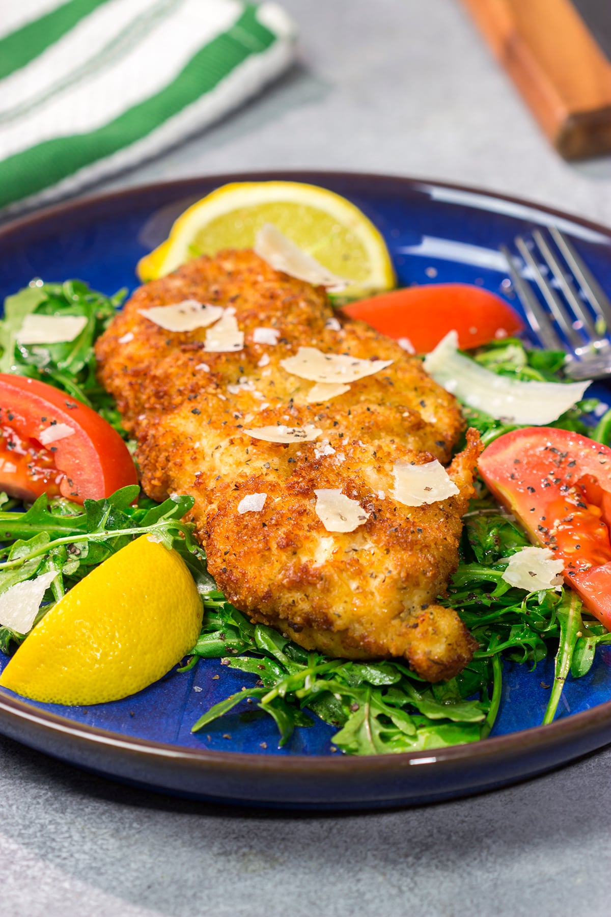 Chicken Milanese features crispy pan-fried chicken cutlets served over a lemony arugula salad. It's surprisingly easy and packed with flavor!
