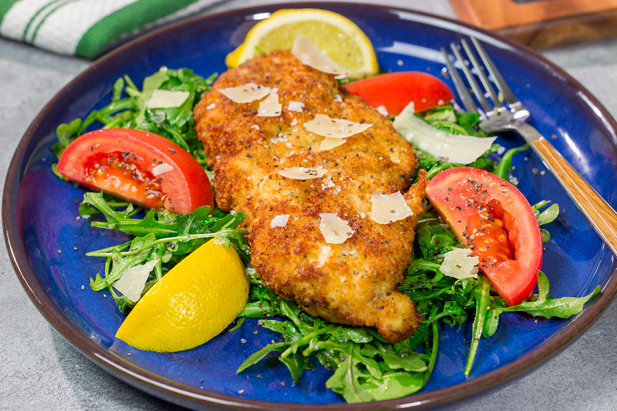 Chicken Milanese features crispy pan-fried chicken cutlets served over a lemony arugula salad. It's surprisingly easy and packed with flavor!