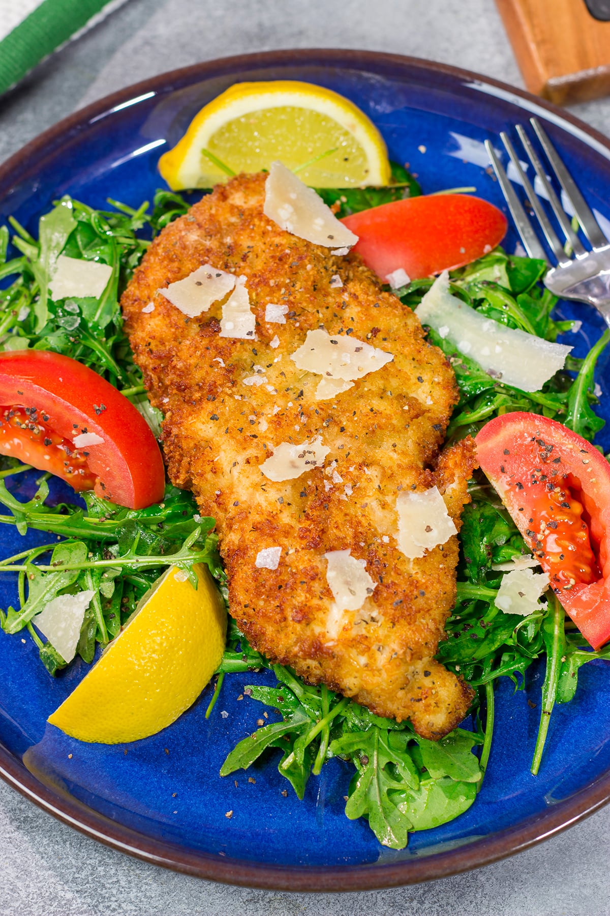 Chicken Milanese features crispy pan-fried chicken cutlets served over a lemony arugula salad. It's surprisingly easy and packed with flavor!