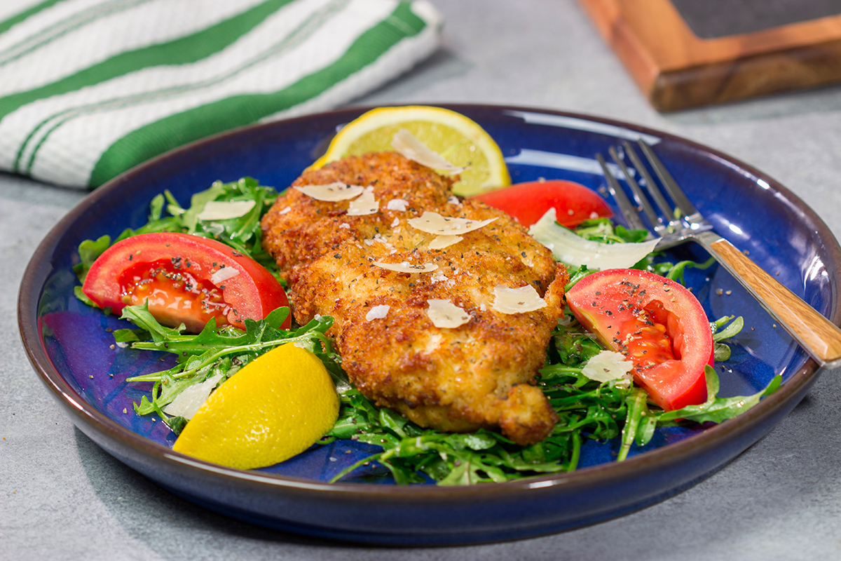 Chicken Milanese features crispy pan-fried chicken cutlets served over a lemony arugula salad. It's surprisingly easy and packed with flavor!