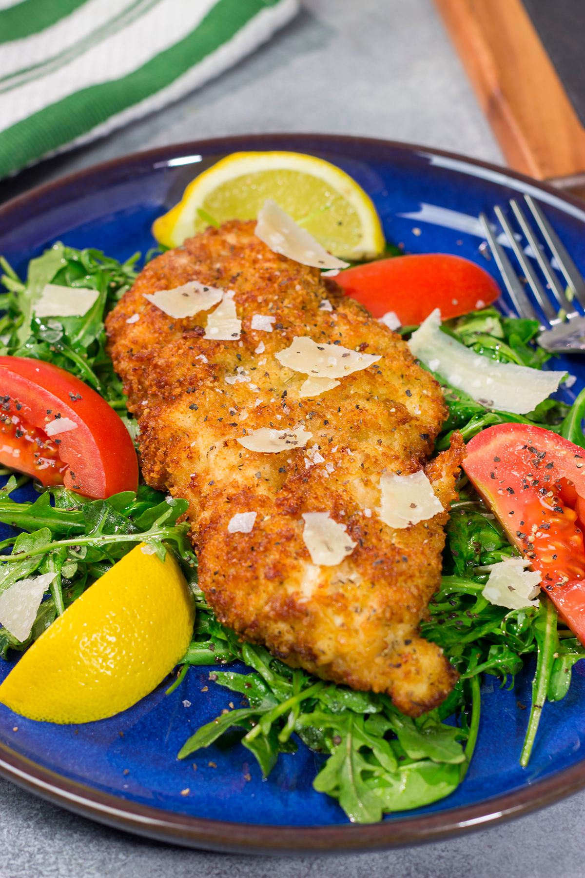 Chicken Milanese features crispy pan-fried chicken cutlets served over a lemony arugula salad. It's surprisingly easy and packed with flavor!
