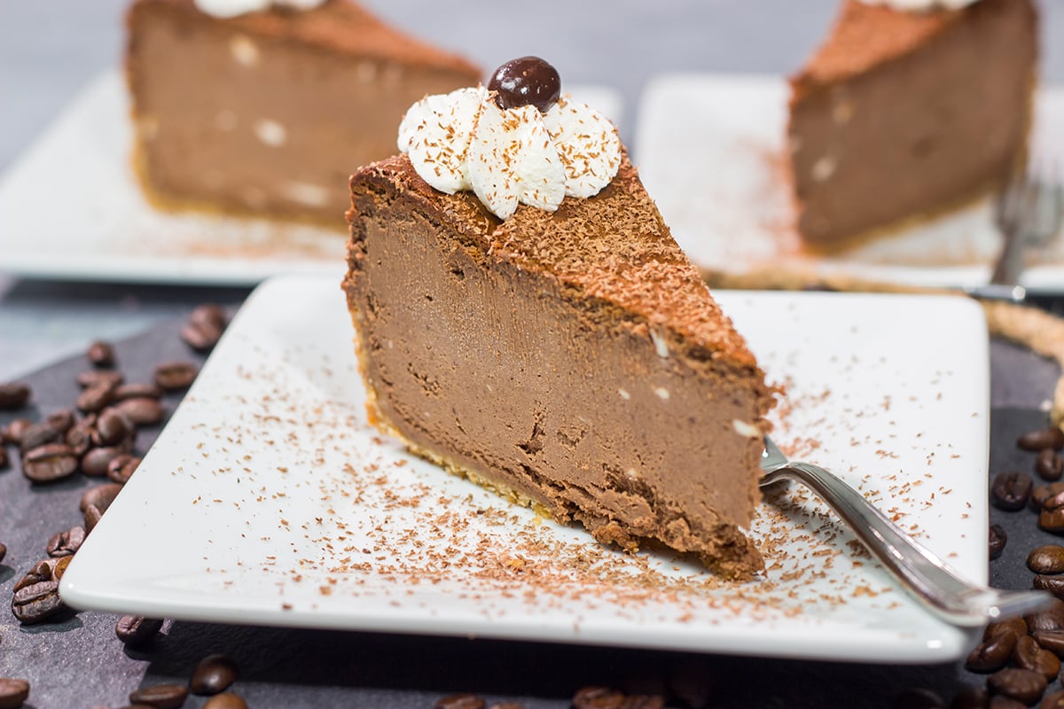 This Chocolate Espresso Cheesecake features the classic combination of chocolate and coffee in a creamy and delicious dessert! Grab a slice for dessert tonight.