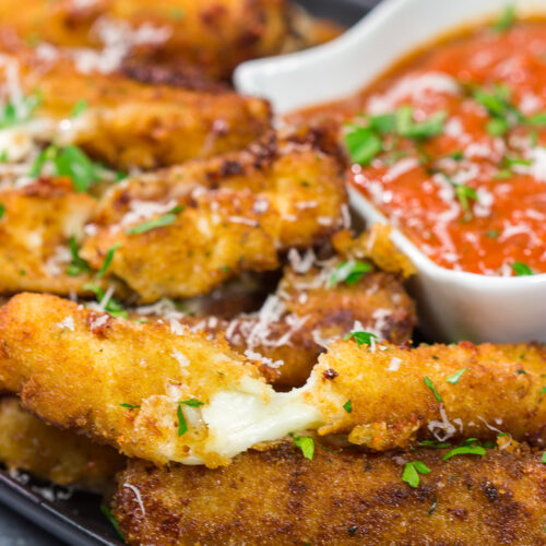 Make your own homemade Fried Mozzarella Sticks and serve 'em with warm marinara sauce. These make a great appetizer for game nights with friends!
